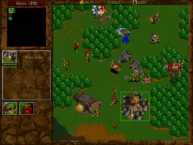 WarCraft II: Tides of Darkness Screenshot (Blizzard Entertainment website, 1997): A Human raiding party attacks an Orcish logging camp.