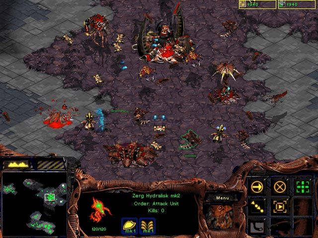 StarCraft Screenshot (Blizzard Entertainment website, early 1998): A Zerg colony comes under attack by Protoss Scouts and Interceptors.