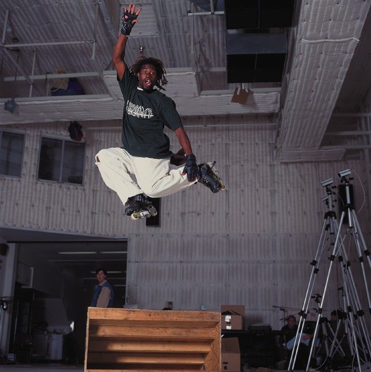 HyperBlade Other (Activision E3 1996 Press Kit): Suspended in mid-air, AJ Jackson performs a ramp jump on the set of HyperBlade.