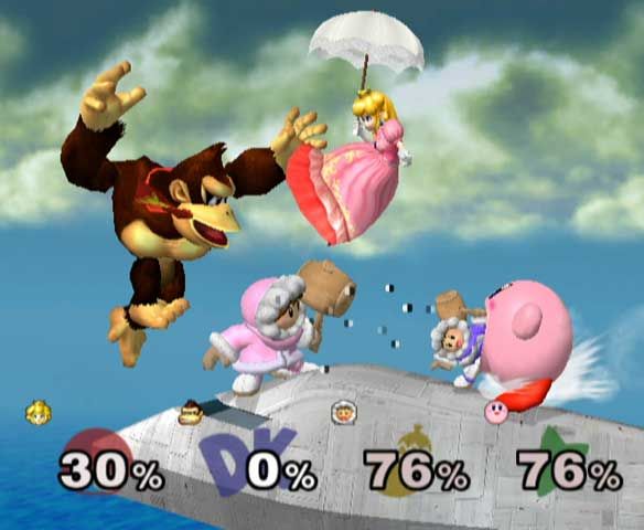 Super Smash Bros.: Melee Screenshot (Official Game Page - Nintendo.com): Action packed melee! This great action shot shows Peach using the umbrella (a new item) as well as Kirby inhaling one of the Ice Climbers.