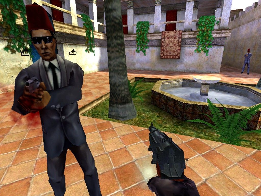 The Operative: No One Lives Forever Screenshot (Official website, 2003): Two H.A.R.M. henchmen assault Agent Archer in the streets of Marrakech. Surveillance Photos section (Morocco)