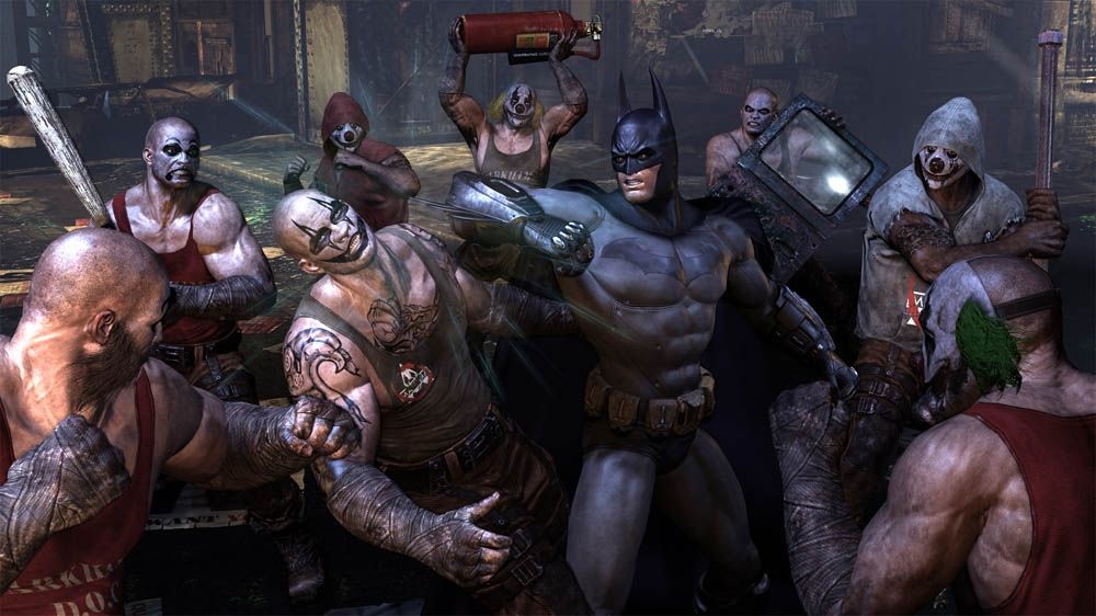 Batman: Arkham City Screenshot (Xbox.com product page): Batman fighting Joker's men