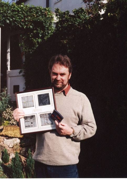 Alien Vs Predator Other (Alien Vs Predator - Impressive Tilework): Alien Vs Predator - Impressive Tilework Paul Johnson holding his tiles and an AvP cartridge