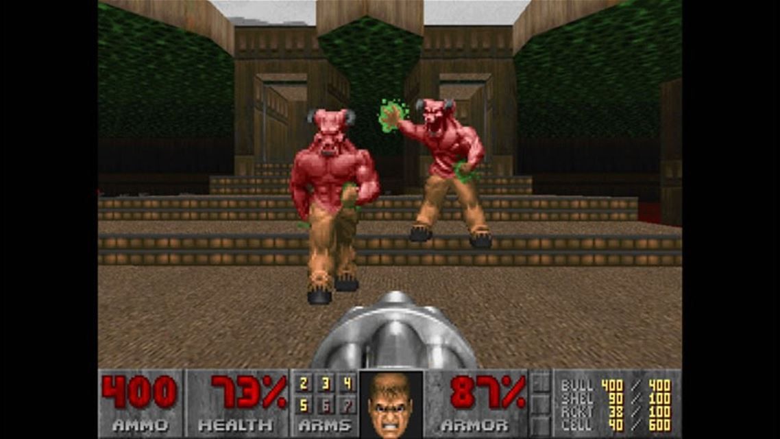 The Ultimate Doom Screenshot (Screenshots): Doomguy has a showdown with two barons