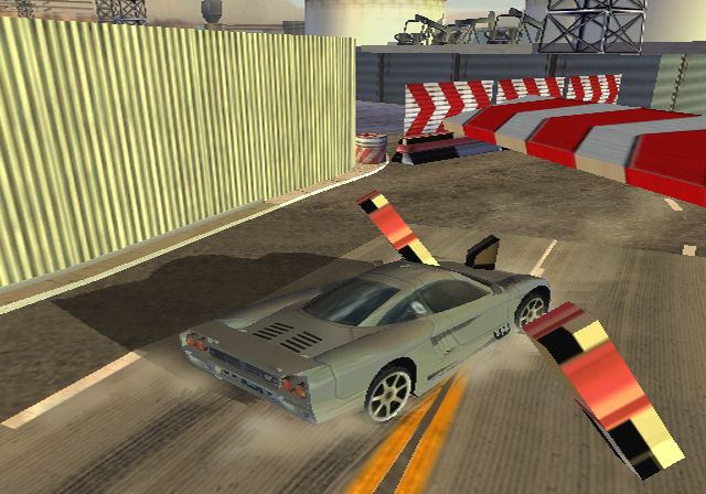 Supercar Street Challenge Screenshot (Activision E3 2001 Press Kit): LA shortcut barricade break (PS2)