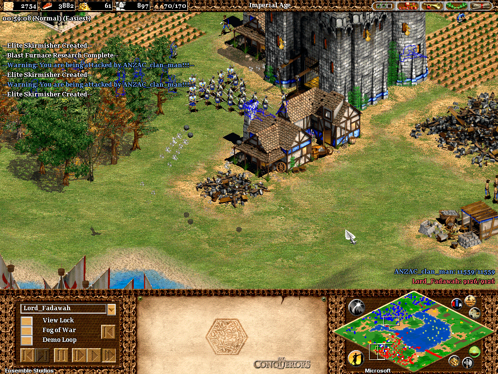 Age of Empires II: The Conquerors (Windows) screenshot: Bombarding the British castle
