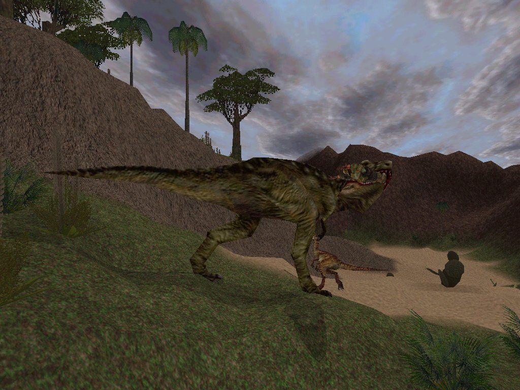 Carnivores 2 (Windows) screenshot: A velociraptor and a T-Rex fight over your still living carcass