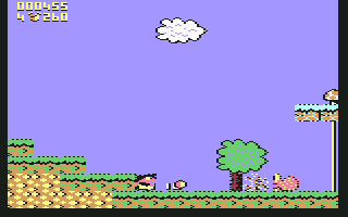 Terry's Big Adventure (Commodore 64) screenshot: Terry throwing his ball at an enemy