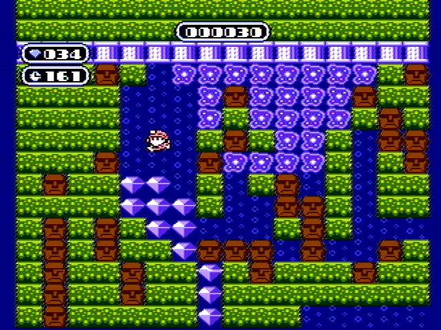 Boulder Dash (NES) screenshot: Those ameoba type things grow and take over the screen