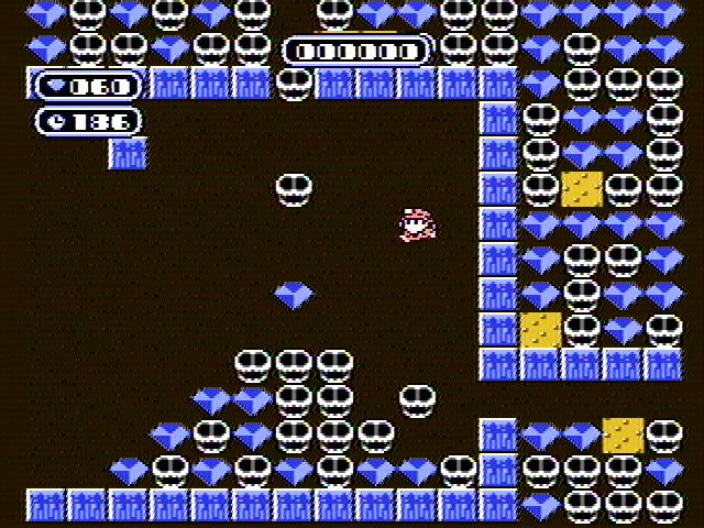 Boulder Dash (NES) screenshot: diamonds and skulls falling from overhead