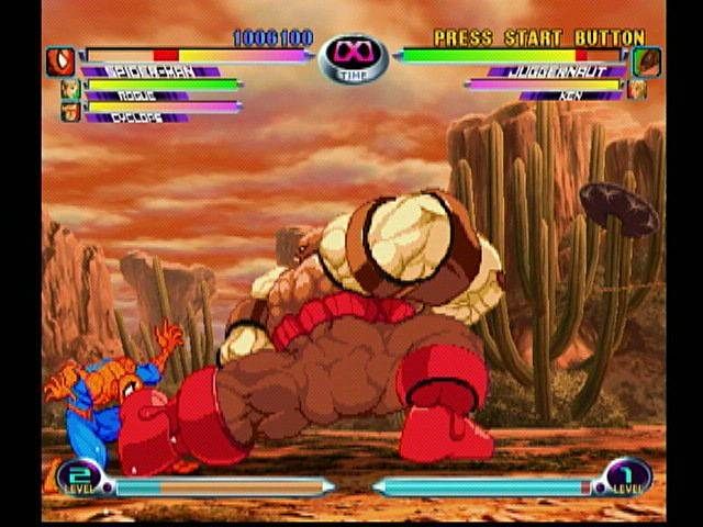 Marvel vs. Capcom 2 (Dreamcast) screenshot: Da Boot. Spiderman gets a body-full of Juggernaut's foot. Some of the characters are huge.