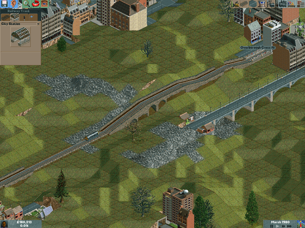 Chris Sawyer's Locomotion (Windows) screenshot: Here is a short train route between cities. You can add many cars to a train as needed