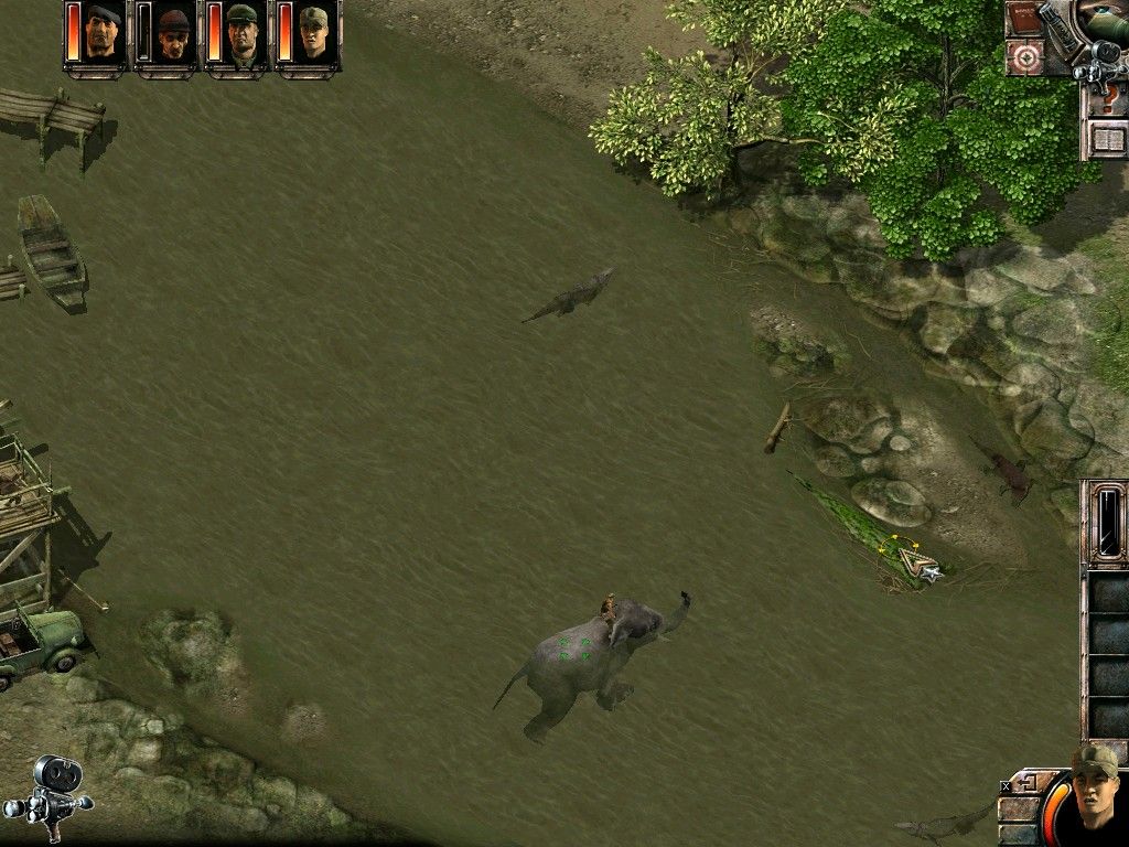 Commandos 2: Men of Courage (Windows) screenshot: Crossing the river full of alligators on an elephant.