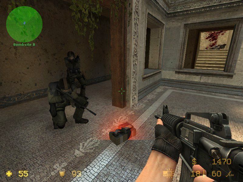 Counter-Strike: Source (Windows) screenshot: Counter Terrorists defusing a bomb.