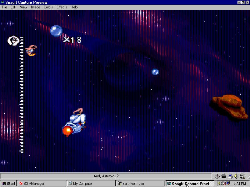 Earthworm Jim: Special Edition (Windows) screenshot: Jim races Psy-Crow through an astroid field.