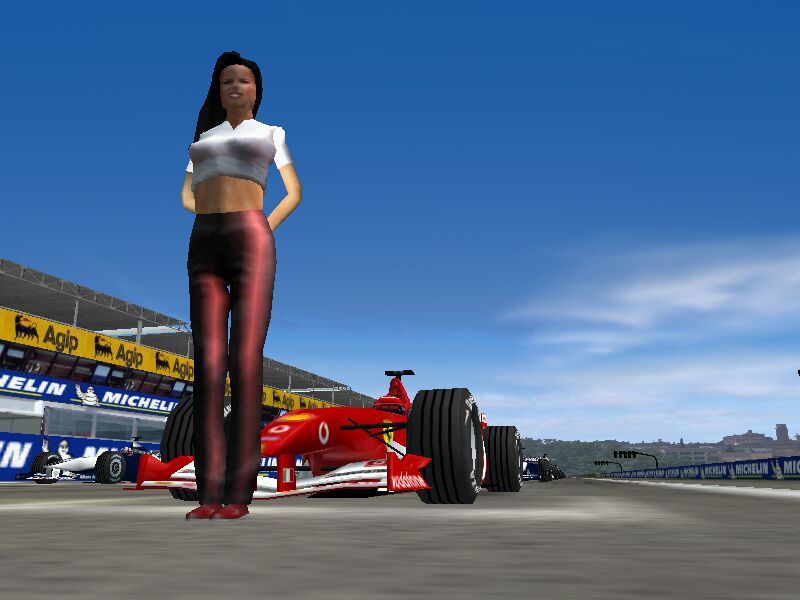 F1 2002 (Windows) screenshot: Grid girl 1
