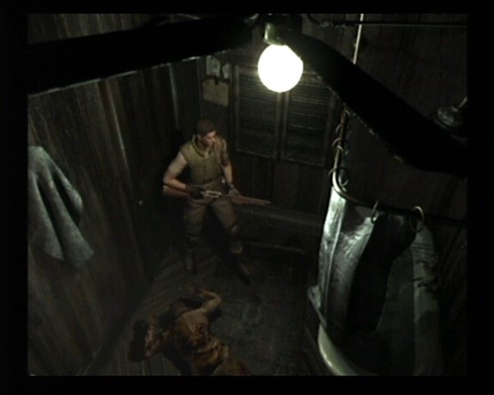 Resident Evil (GameCube) screenshot: Chris Scenario - Good thing about this zombie is that it's down, bad point is that you never know when he'll decide to get up