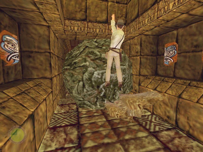 Indiana Jones and the Infernal Machine (Windows) screenshot: Indy uses his whip to escape the rolling boulder.