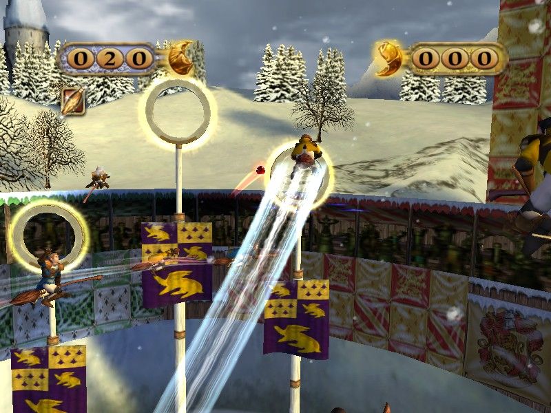 Harry Potter: Quidditch World Cup (Windows) screenshot: Attacking the goal in a winter match at Hogwarts.