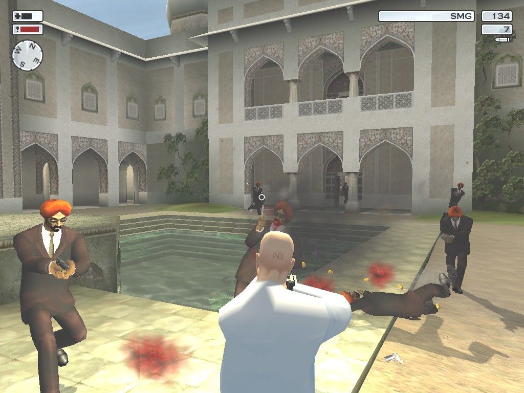Hitman 2: Silent Assassin (Windows) screenshot: Mr. 47 makes trouble inside a Gurdwara temple in Punjab, India. The rather upset inhabitants were originally supposed to be Sikhs, but for reasons of political correctness the game now refers to them as generic cultists.