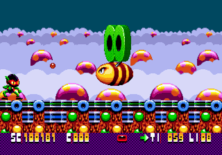 Zool (Genesis) screenshot: Boss (with two green Life Savers on his back)
