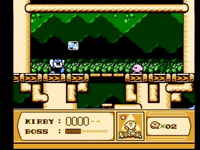 Kirby's Adventure (NES) screenshot: Eat the blocks this guy tosses at you and then use them as weapons