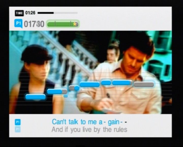 SingStar: Party (PlayStation 2) screenshot: The better you sing, pitch display will start to glow blue to give you more points (yup, that's David Boreanaz in the video)