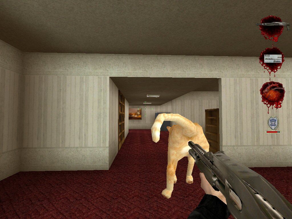 Postal² (Windows) screenshot: Using a cat as a silencer. Isn't that delightfully evil?