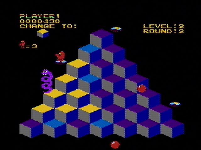 Q*bert (NES) screenshot: Riding a disc to the top of the pyramid