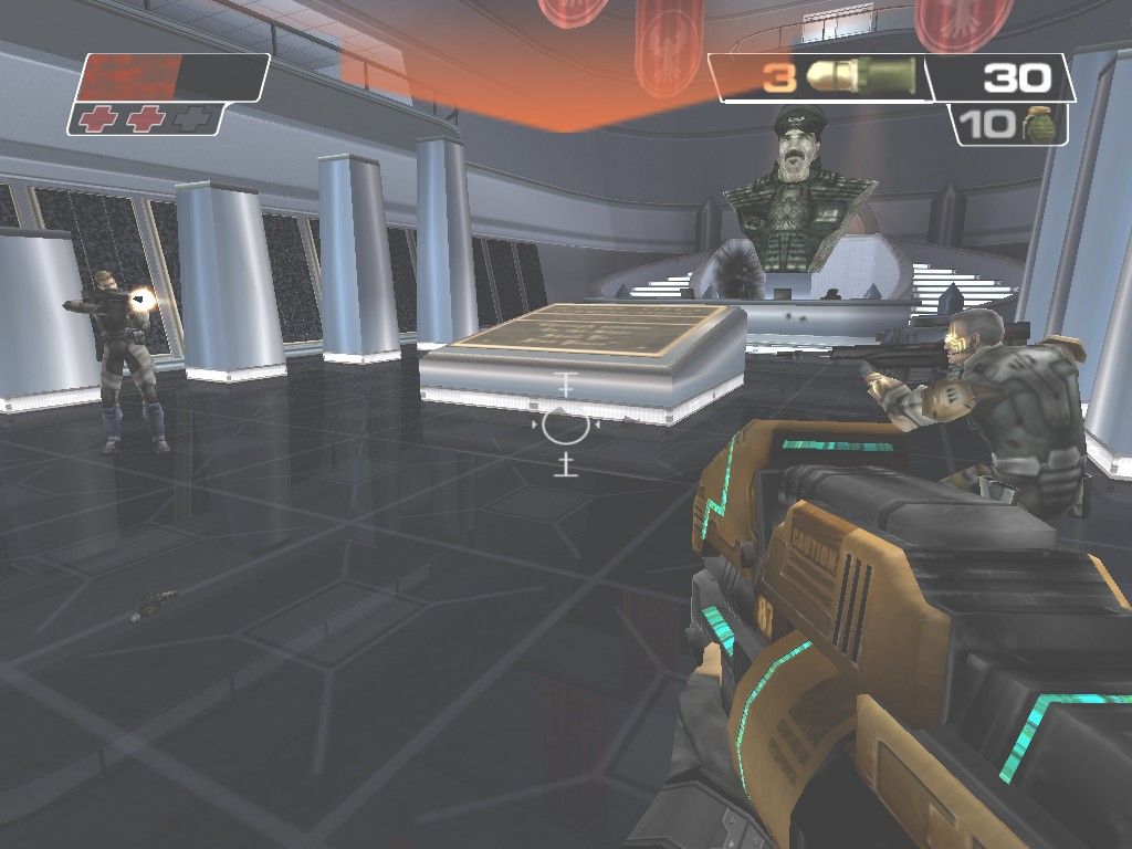 Red Faction II (Windows) screenshot: Molov, your nano-augmented squad leader (voice of Lance Henriksen), helps you battle the security guards in the P.I.B. Lobby. Note the giant oversized bust of Sopot