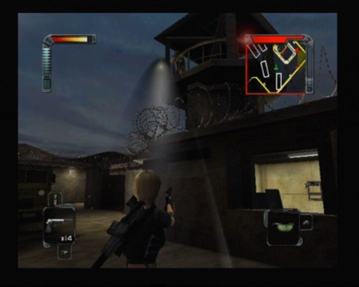 Rogue Ops (PlayStation 2) screenshot: The guard at the tower spotted you, and your silence gun is no match for his machine gun in the open so act quickly
