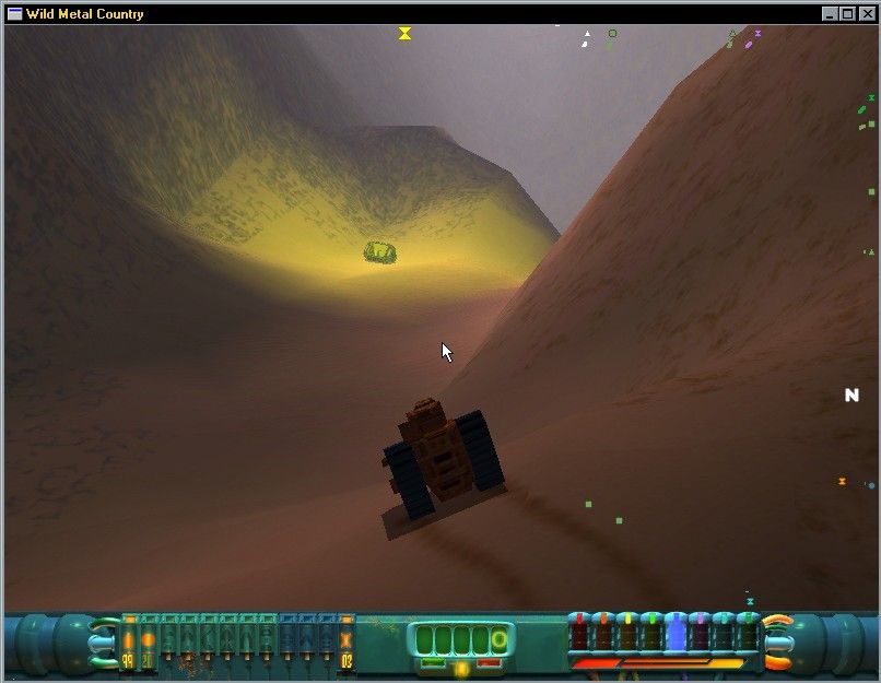 Wild Metal Country (Windows) screenshot: The yellow power core (note how the tracks leave marks in the sand)