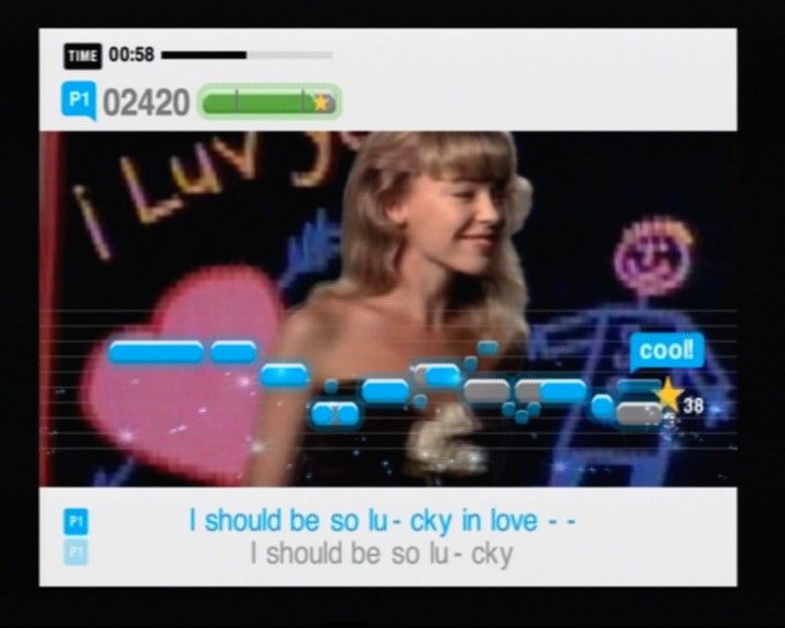 SingStar: Party (PlayStation 2) screenshot: "I should be so lucky" to be able to sing along Kylie so good