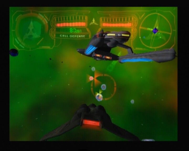 Star Trek: Shattered Universe (PlayStation 2) screenshot: Flying Klingon "Bird of Prey" while protecting your ship from cell defenses