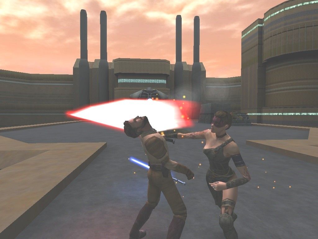 Star Wars: Jedi Knight II - Jedi Outcast (Collector's Edition) (Windows) screenshot: Whenever someone loses a lightsaber duel, the camera does a cool 360 degree Matrix-style spin. Here, Tavion gives Kyle a much undeserved lightsaber lobotomy