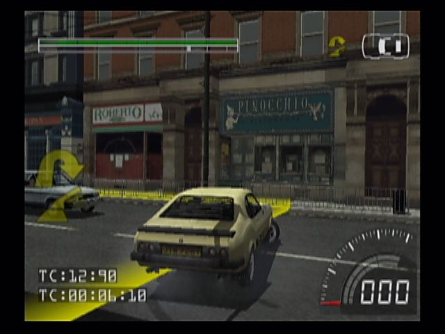 Stuntman (PlayStation 2) screenshot: Follow the yellow markers on the road... You'll need to precisely follow the onscreen and verbal prompts in order to make the director happy (who for some reason wants all the stunts in one take).