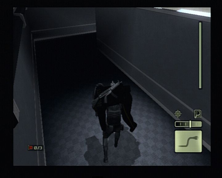 Tom Clancy's Splinter Cell (PlayStation 2) screenshot: It is always wise to carry you fallen enemy into a shadowy corner so another guard wouldn't sound the alarm if noticing the body.