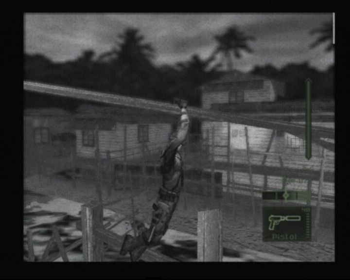 Tom Clancy's Splinter Cell: Pandora Tomorrow (PlayStation 2) screenshot: Sliding downwards, and all Sam needs is a pair of gloves, what a hero