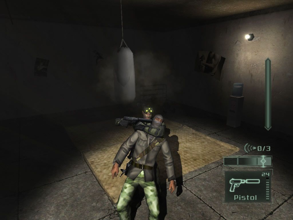Tom Clancy's Splinter Cell: Pandora Tomorrow (Windows) screenshot: You can keep enemies hostage: knock them out, use them as a human shield or force them to open a door.
