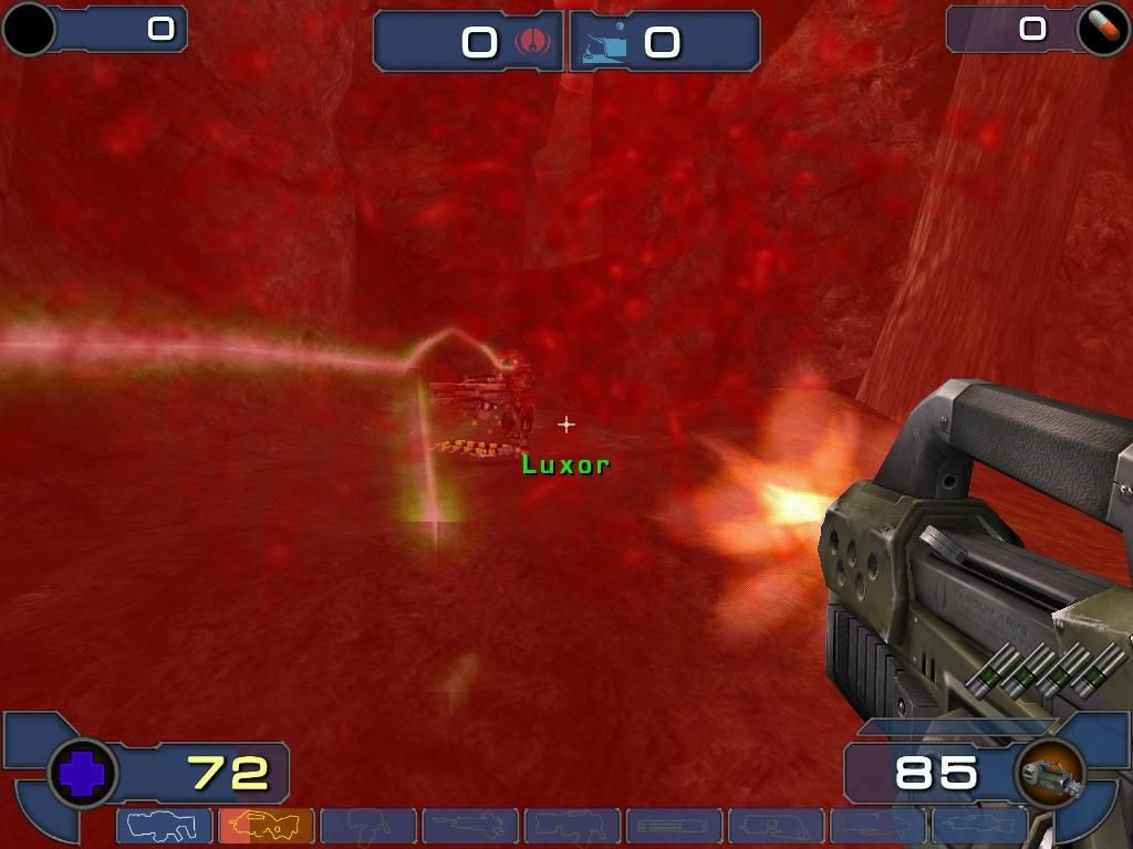 Unreal Tournament 2003 (Windows) screenshot: That's me, with blood running down my face. I'll be dead soon, as I'm using the default weapon.
