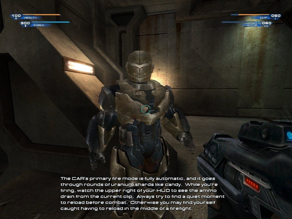 Unreal II: The Awakening (Windows) screenshot: This hologram instructs you on weapon usage, and gives you a chance to fire them.