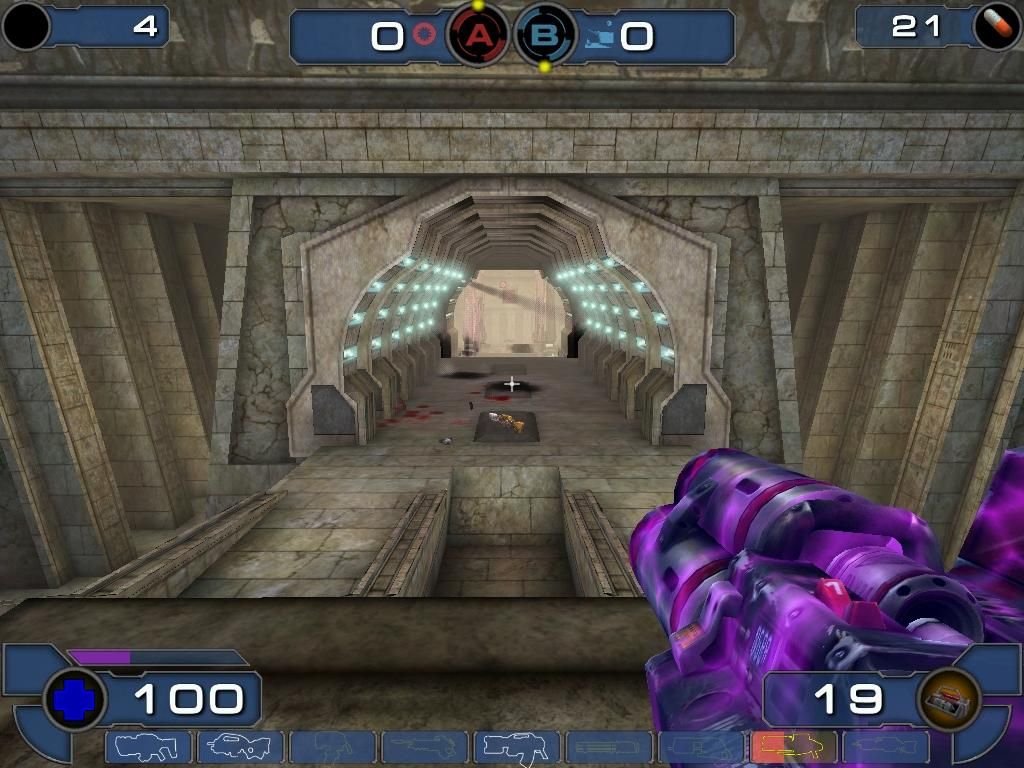 Unreal Tournament 2003 (Windows) screenshot: When your weapon glows, you've run over a Damage Amplifier and can kick serious ass.