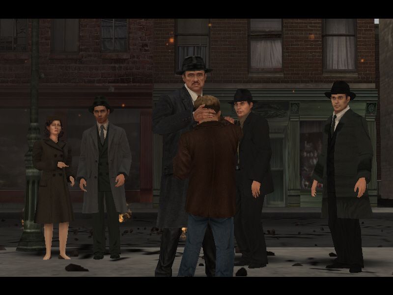 The Godfather: The Game (Windows) screenshot: The Godfather consoles the young son.
