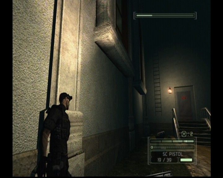 Tom Clancy's Splinter Cell: Chaos Theory (Xbox) screenshot: Sneaking past the wall to avoid being detected by the camera above you.