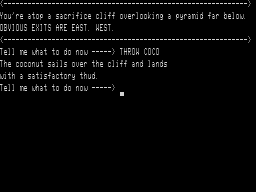 Quest for Fire (TRS-80) screenshot: Tossing my Coconut off a Cliff