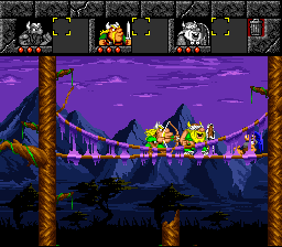 The Lost Vikings (SNES) screenshot: On a bridge, fighting a slug