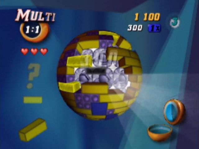 Tetrisphere (Nintendo 64) screenshot: The aim here is to remove enough pieces from the core to uncover a picture