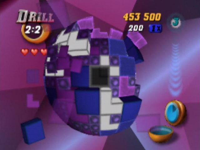 Tetrisphere (Nintendo 64) screenshot: All the white 'L' blocks are about to be destroyed