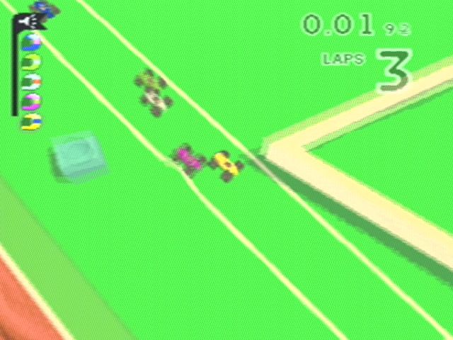 Micro Machines V3 (PlayStation) screenshot: Racing round a pool table