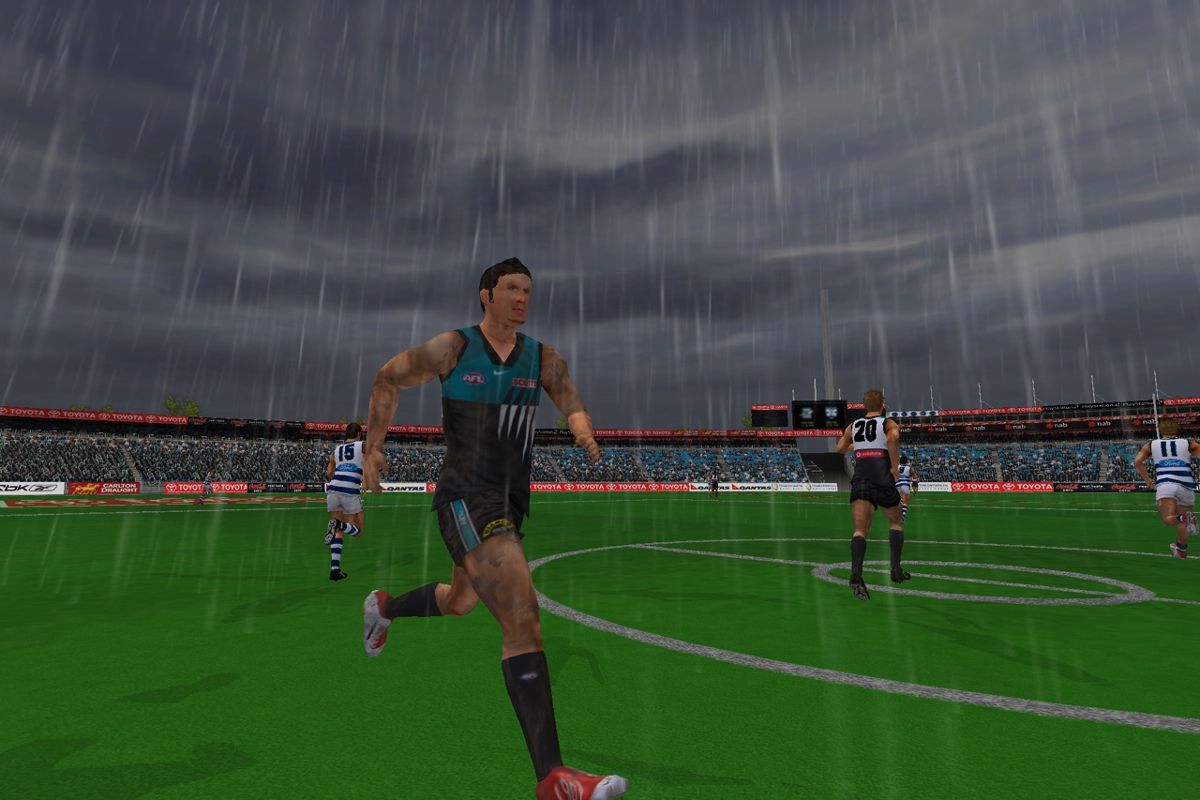AFL Premiership 2006 (PlayStation 2) screenshot: Port Adelaide vs Geelong in the rain